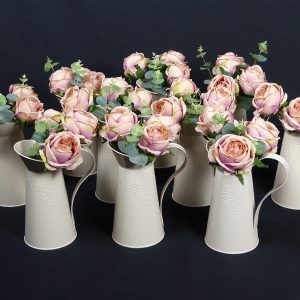 Vintage cream jugs with flowers perfect for weddings and events